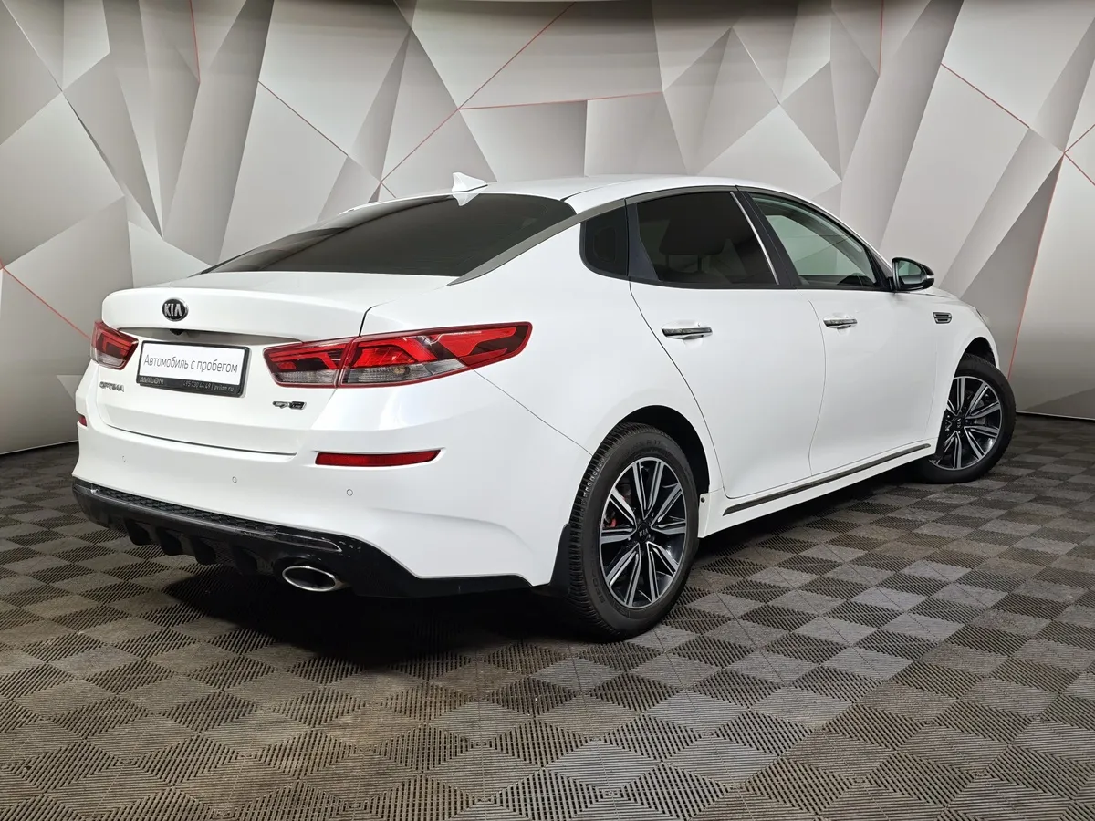Kia Optima 2.0 AT (150 л.с.) Fleet Белый в АВИЛОН. Слайд №2