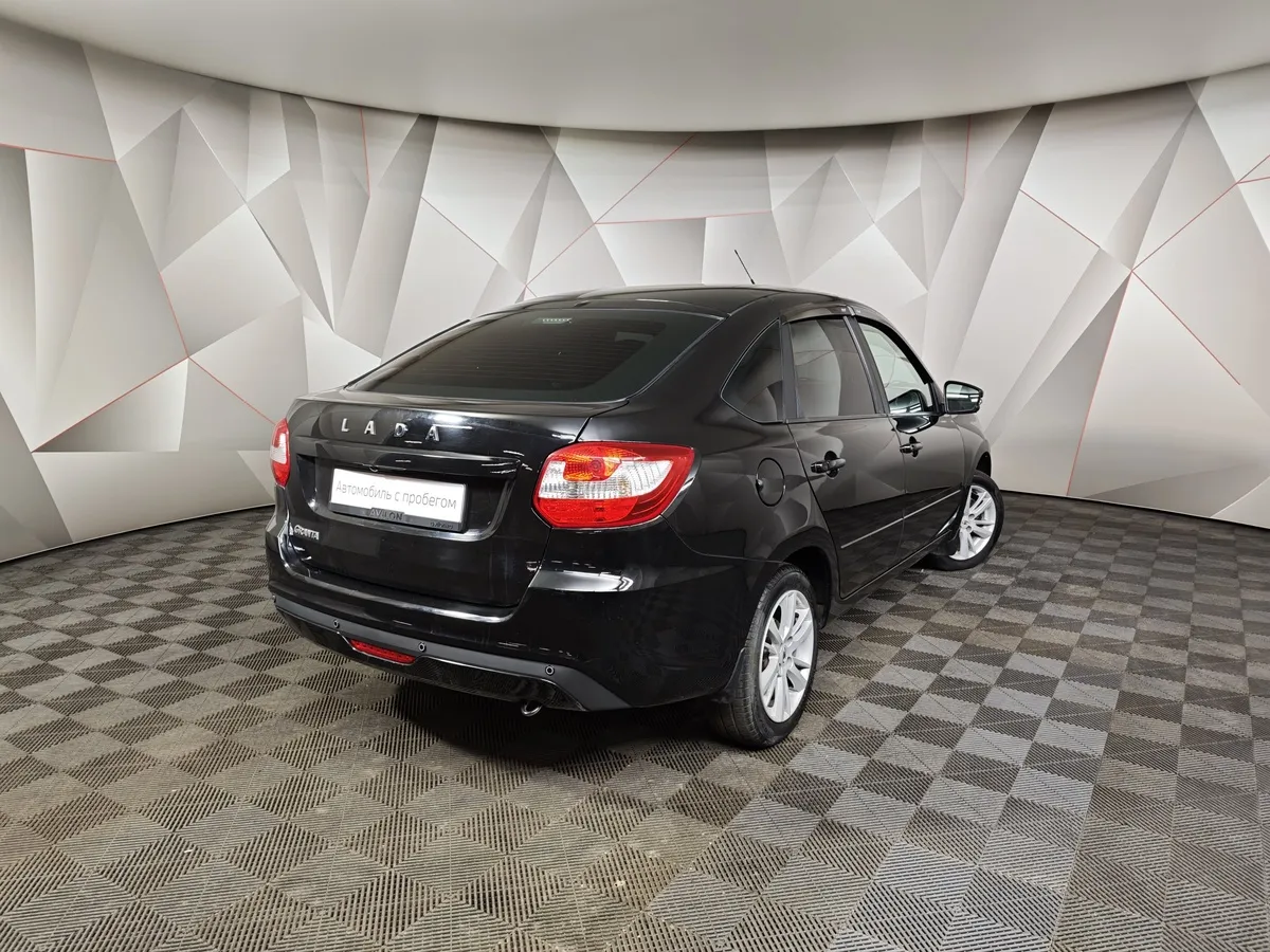 ВАЗ (Lada) Granta 1.6 MT 8кл (87 л.с.) Черный в АВИЛОН. Слайд №2