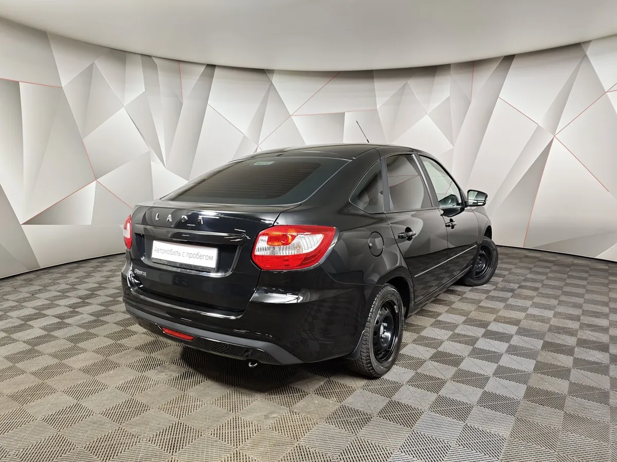 ВАЗ (Lada) Granta 1.6 MT 16кл (106 л.с.) Черный в АВИЛОН. Слайд №2