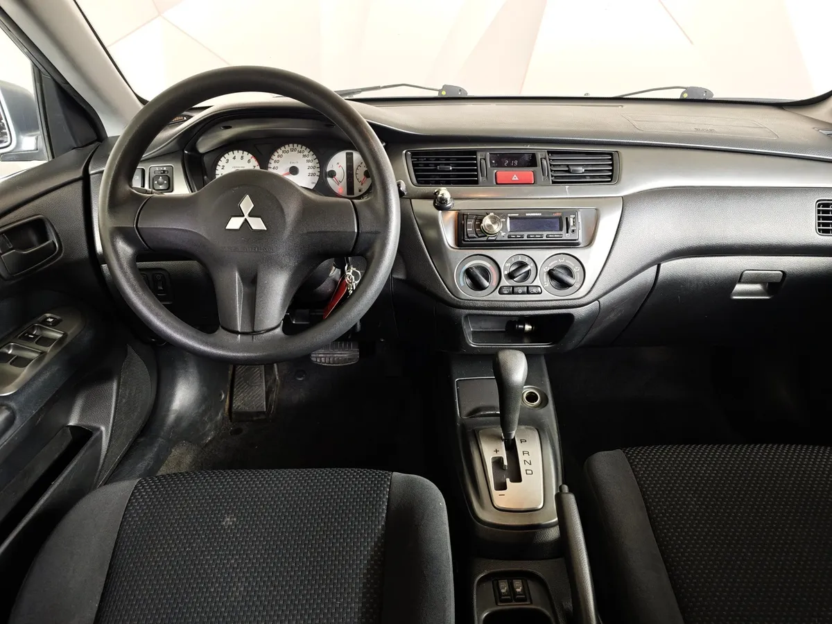 Mitsubishi Lancer 1.6 AT (98 л.с.) Серебристый в АВИЛОН. Слайд №18