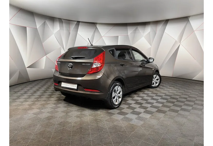 Hyundai Solaris 1.4 AT (107 л.с.) Comfort Коричневый в АВИЛОН. Слайд №2
