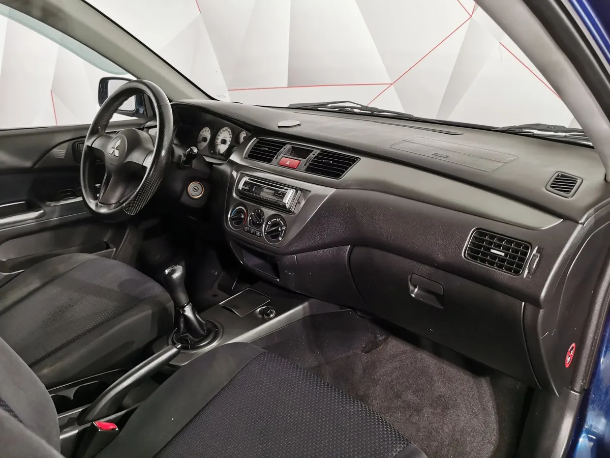 Mitsubishi Lancer 1.6 MT (100 л.с.) Синий в АВИЛОН. Слайд №11