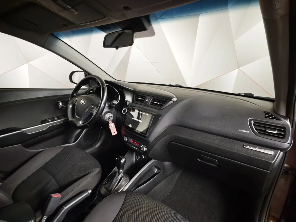 Kia Rio 1.6 AT (123 л.с.) Prestige Коричневый в АВИЛОН. Слайд №11