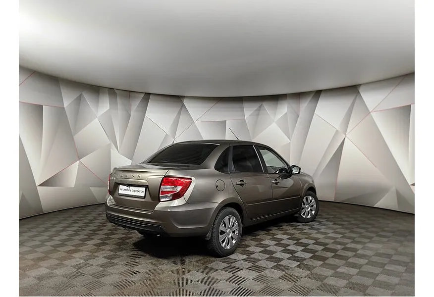 ВАЗ (Lada) Granta 1.6 MT 16 кл (106 л.с.) Коричневый в АВИЛОН. Слайд №2