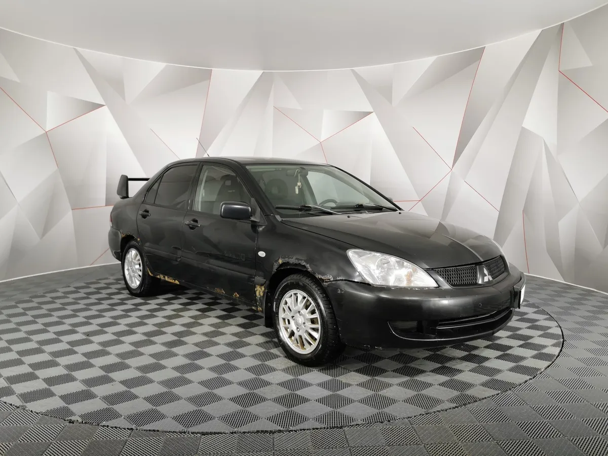 Mitsubishi Lancer 1.3 MT (82 л.с.) Черный в АВИЛОН. Слайд №3
