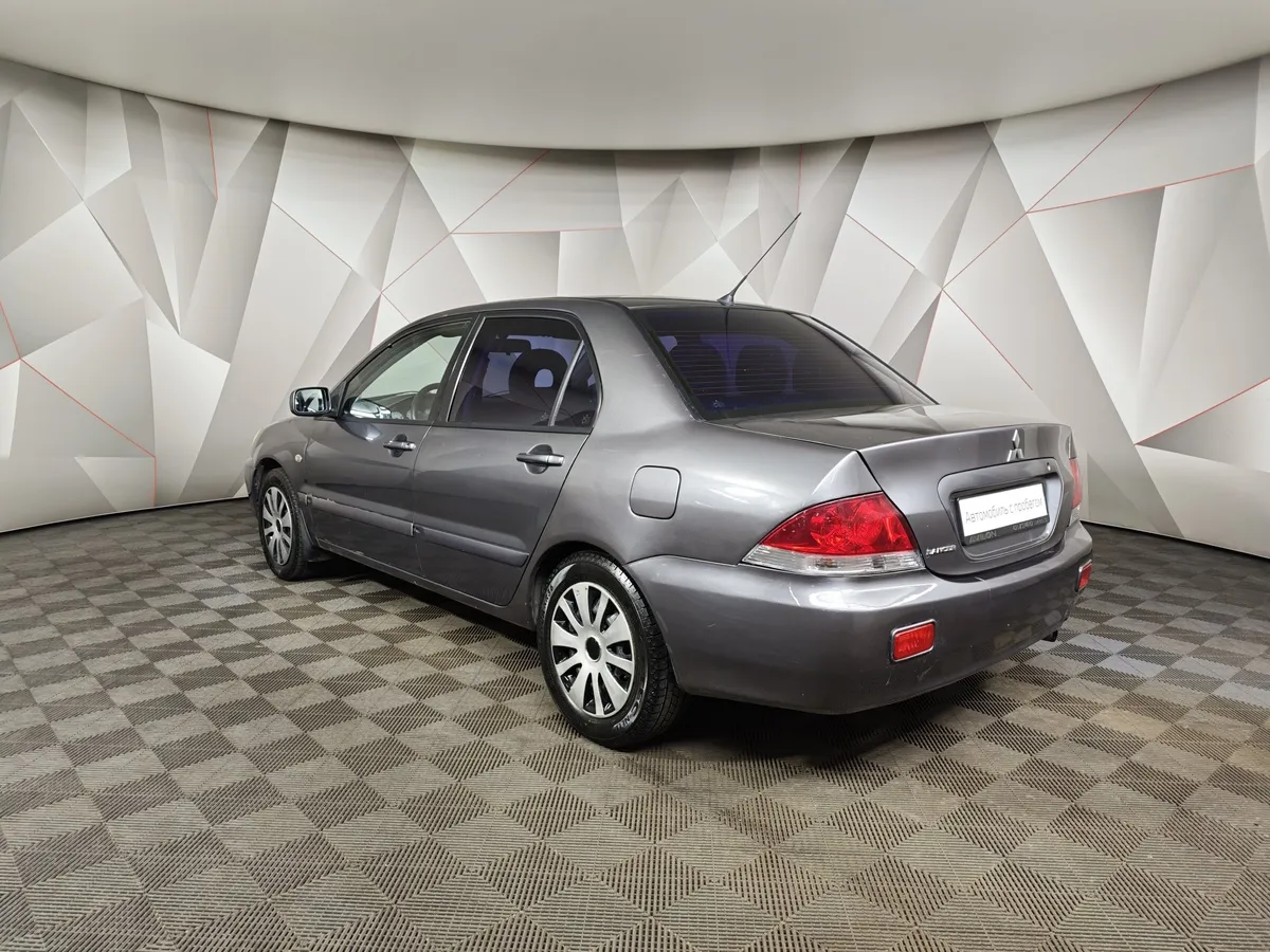 Mitsubishi Lancer 1.6 MT (100 л.с.) Серый в АВИЛОН. Слайд №4