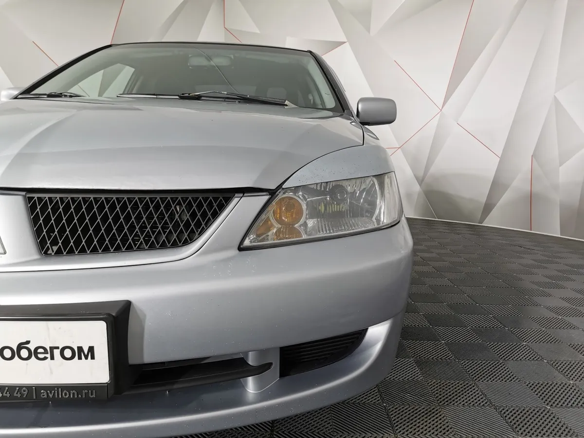 Mitsubishi Lancer 1.6 MT (98 л.с.) Серый в АВИЛОН. Слайд №10