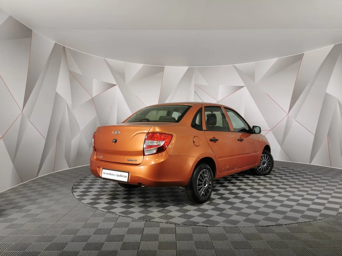 ВАЗ (Lada) Granta 1.6 AT 16кл (98 л.с.) Оранжевый в АВИЛОН. Слайд №2