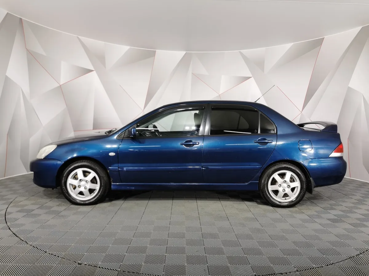 Mitsubishi Lancer 1.6 MT (100 л.с.) Синий в АВИЛОН. Слайд №5