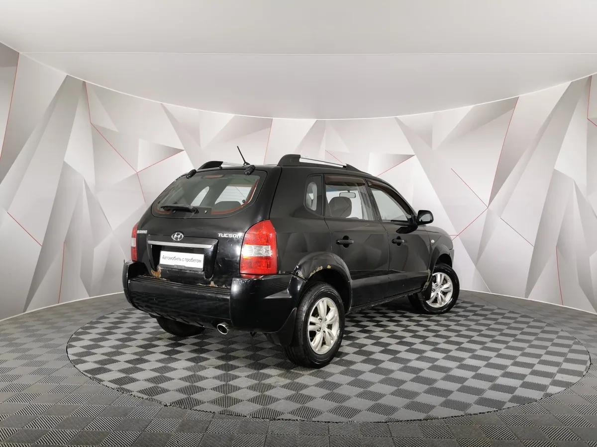 Hyundai Tucson 2.0 AT (150 л.с.) Черный в АВИЛОН. Слайд №2
