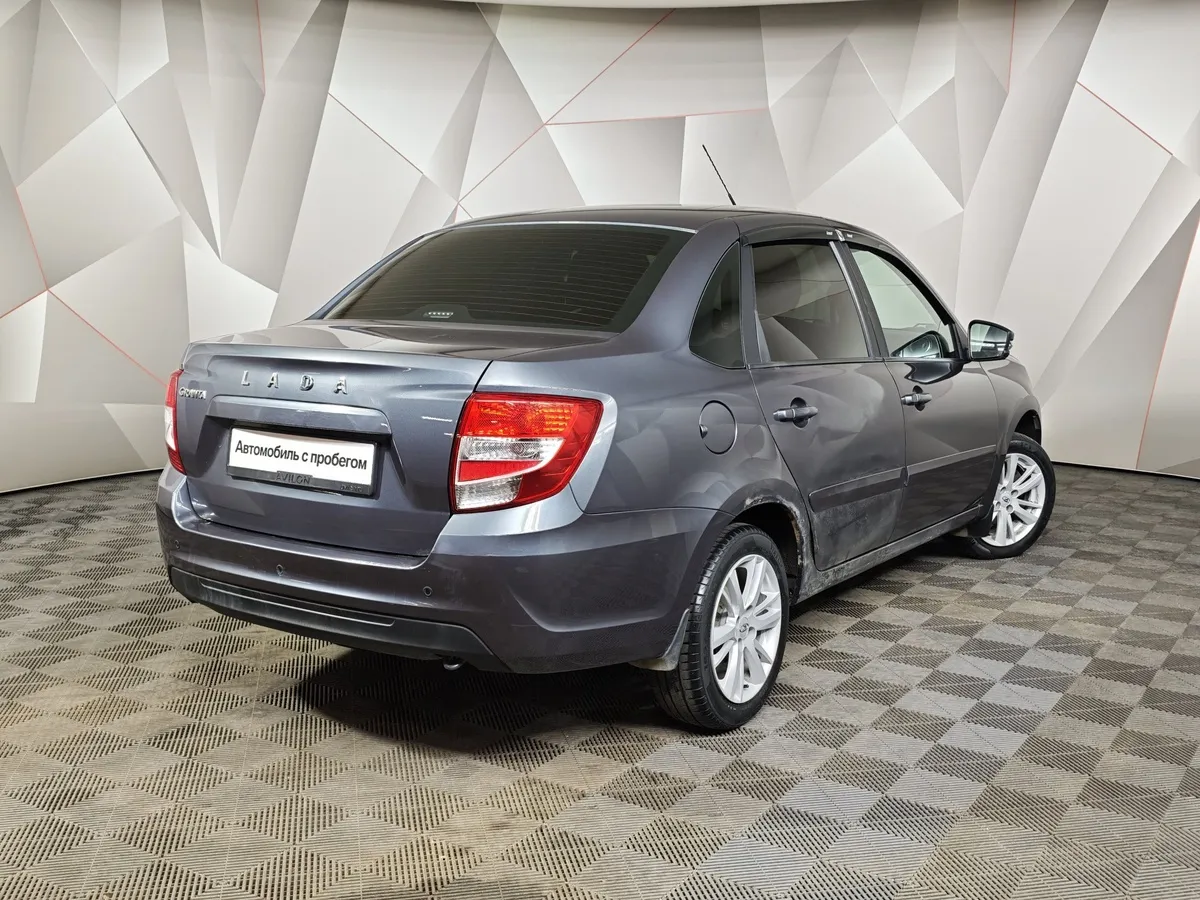 ВАЗ (Lada) Granta 1.6 MT 16 кл (106 л.с.) Серый в АВИЛОН. Слайд №2