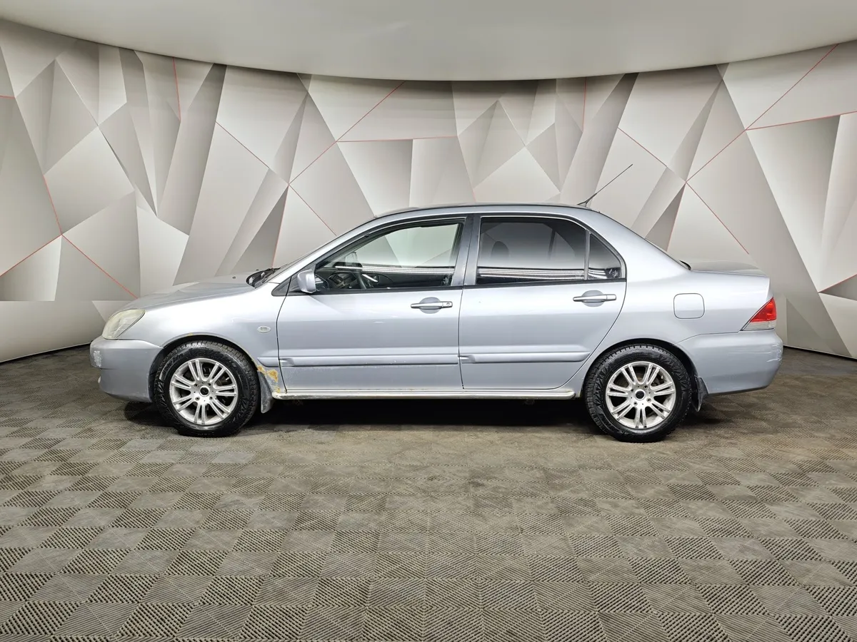 Mitsubishi Lancer 1.6 AT (98 л.с.) Серебристый в АВИЛОН. Слайд №5