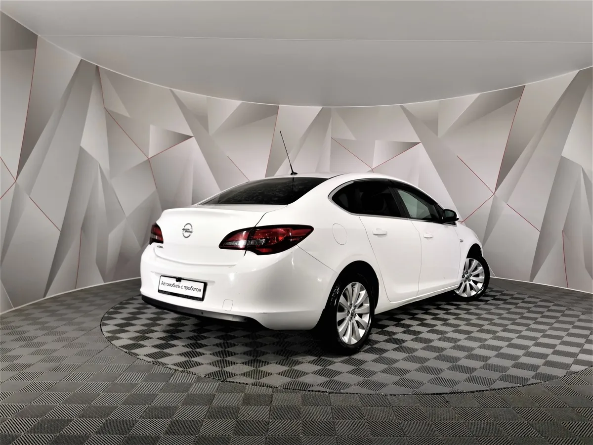 Opel Astra 1.6 AT (115 л.с.) Белый в АВИЛОН. Слайд №2