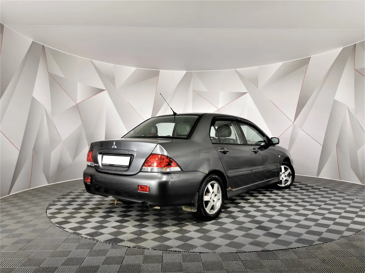 Mitsubishi Lancer 1.6 AT (98 л.с.) Серый в АВИЛОН. Слайд №2