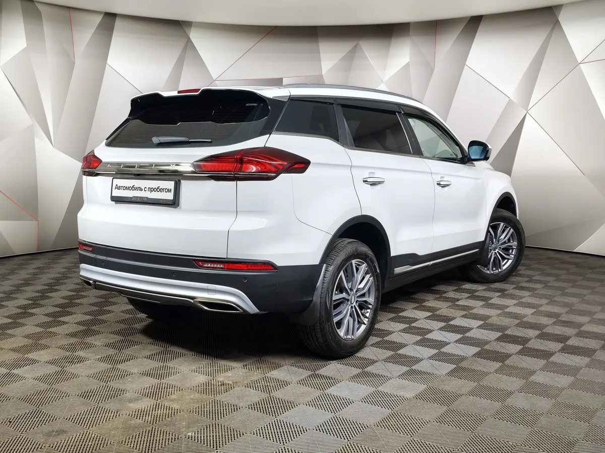 Geely Atlas Pro 1.5T 7DCT AWD (177 л.с.) Flagship Белый в АВИЛОН. Слайд №2