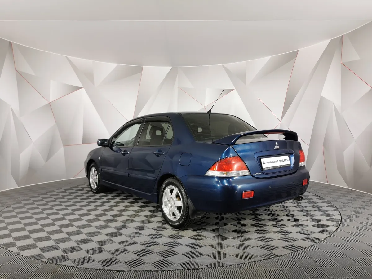 Mitsubishi Lancer 1.6 MT (100 л.с.) Синий в АВИЛОН. Слайд №4