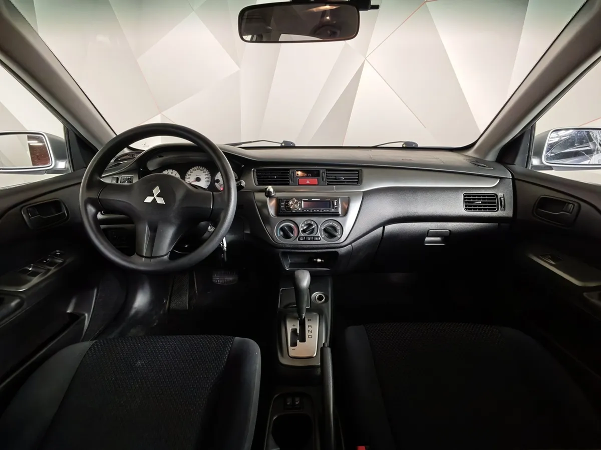 Mitsubishi Lancer 1.6 AT (98 л.с.) Серебристый в АВИЛОН. Слайд №12