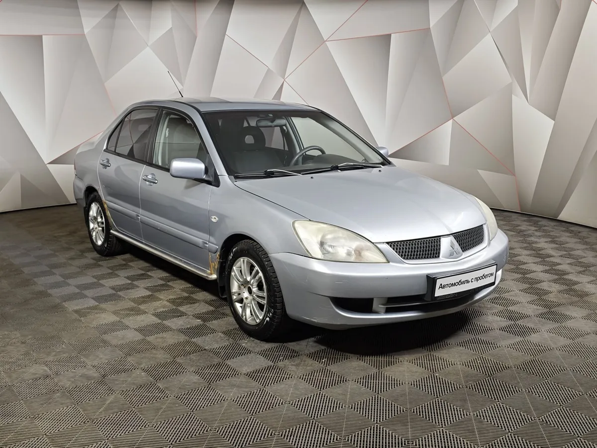 Mitsubishi Lancer 1.6 AT (98 л.с.) Серебристый в АВИЛОН. Слайд №3