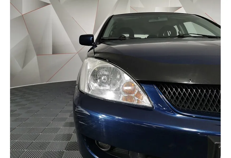 Mitsubishi Lancer 1.6 MT (100 л.с.) Синий в АВИЛОН. Слайд №16