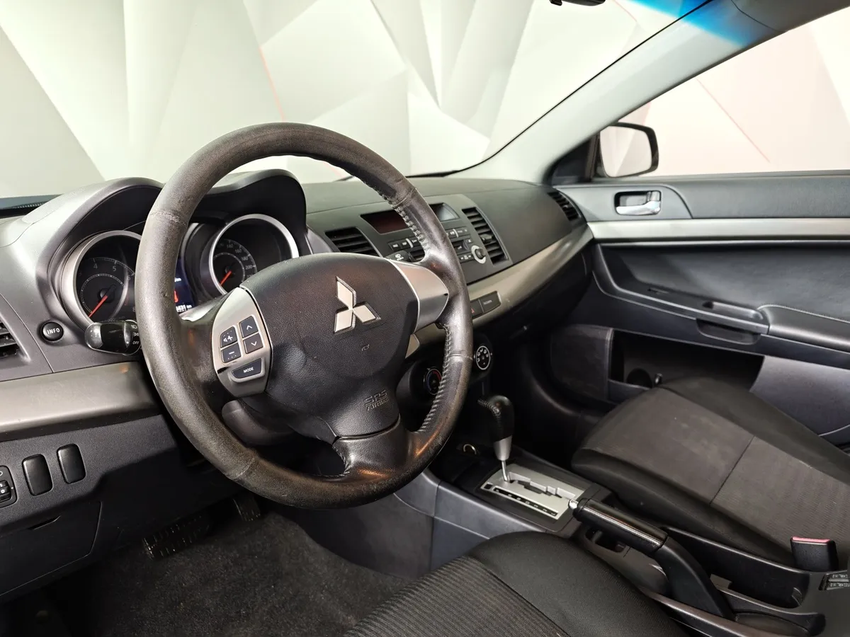 Mitsubishi Lancer 1.6 AT (117 л.с.) Серый в АВИЛОН. Слайд №19