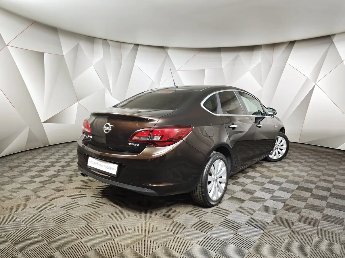 Opel Astra 1.4 Turbo AT (140 л.с.) Коричневый в АВИЛОН. Слайд №2