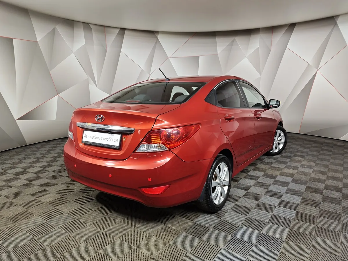 Hyundai Solaris 1.4 AT (100 л.с.) Active Красный в АВИЛОН. Слайд №2