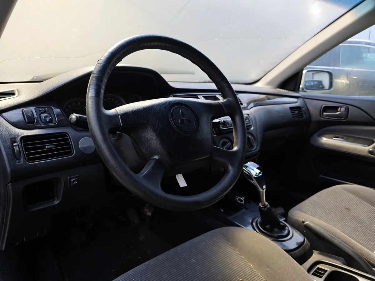 Mitsubishi Lancer 1.3 MT (82 л.с.) Белый в АВИЛОН. Слайд №8