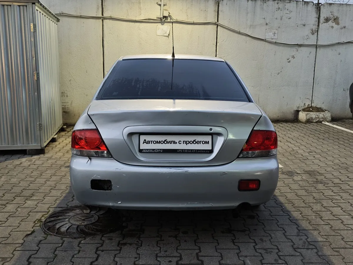 Mitsubishi Lancer 1.3 MT (82 л.с.) Белый в АВИЛОН. Слайд №7