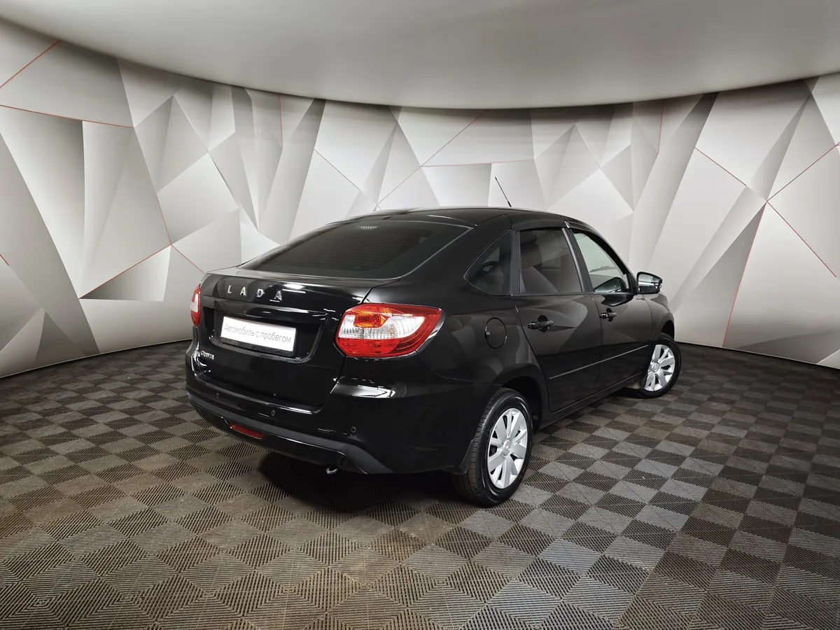 ВАЗ (Lada) Granta 1.6 MT 8кл (87 л.с.) Черный в АВИЛОН. Слайд №2