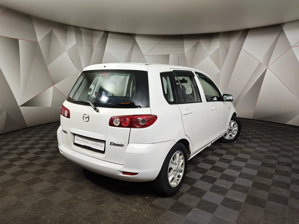 Mazda Demio 1.5 AT (100 л.с.) Белый в АВИЛОН. Слайд №2