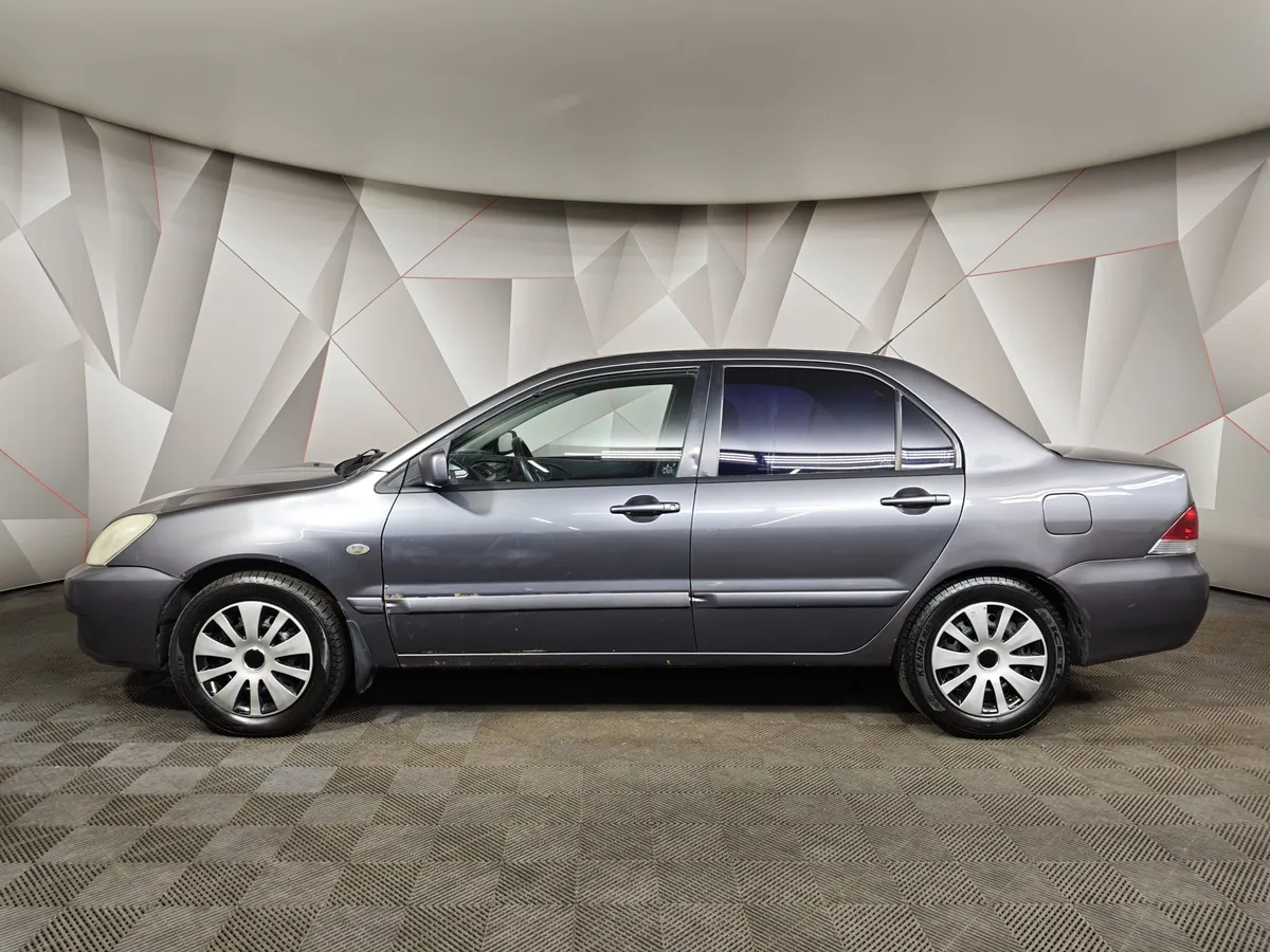Mitsubishi Lancer 1.6 MT (100 л.с.) Серый в АВИЛОН. Слайд №5