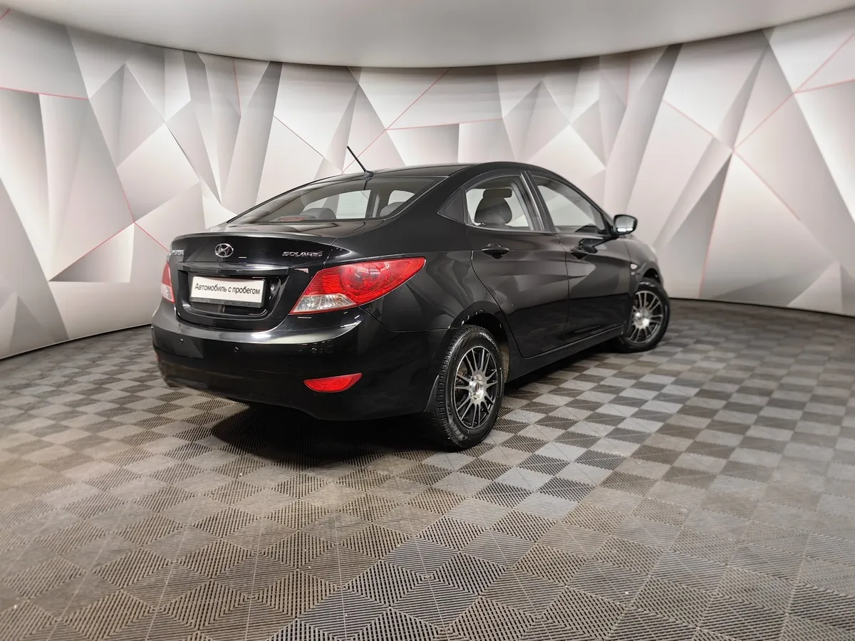 Hyundai Solaris 1.6 MT (123 л.с.) Optima Черный в АВИЛОН. Слайд №2