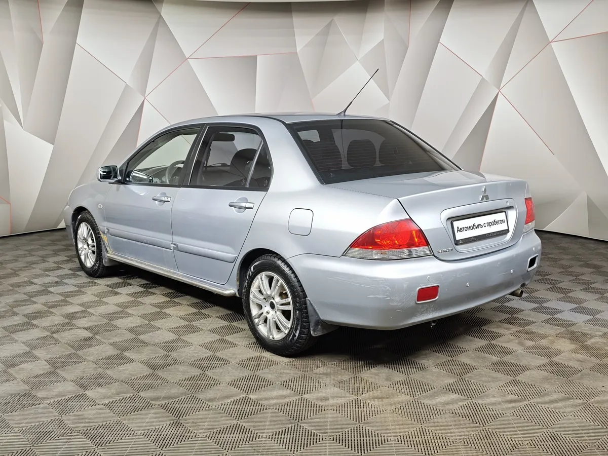 Mitsubishi Lancer 1.6 AT (98 л.с.) Серебристый в АВИЛОН. Слайд №4