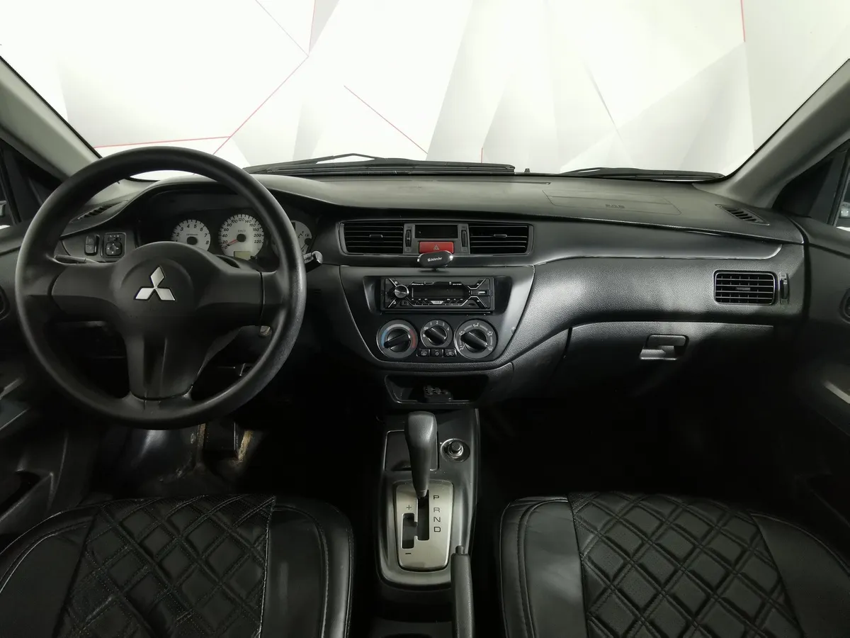Mitsubishi Lancer 1.6 AT (98 л.с.) Серый в АВИЛОН. Слайд №11