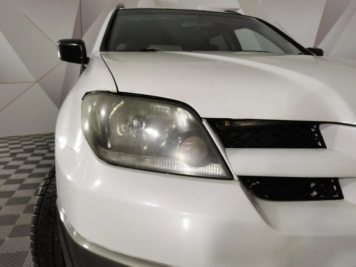 Mitsubishi Outlander 2.4 AT 4WD (160 л.с.) Белый в АВИЛОН. Слайд №10