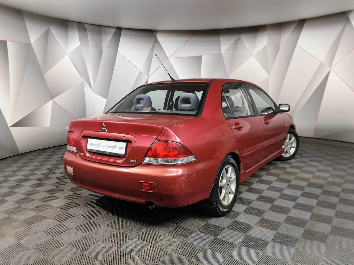 Mitsubishi Lancer 1.6 AT (98 л.с.) Красный в АВИЛОН. Слайд №2