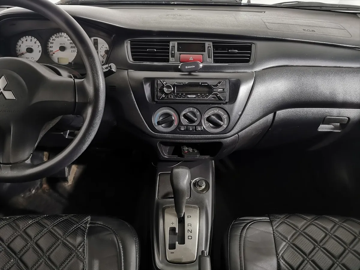 Mitsubishi Lancer 1.6 AT (98 л.с.) Серый в АВИЛОН. Слайд №12