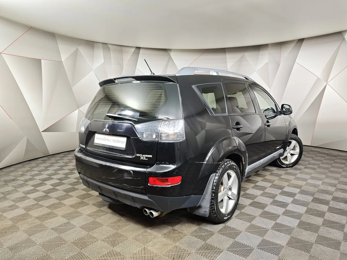 Mitsubishi Outlander 3.0 AT 4WD (223 л.с.) Черный в АВИЛОН. Слайд №2