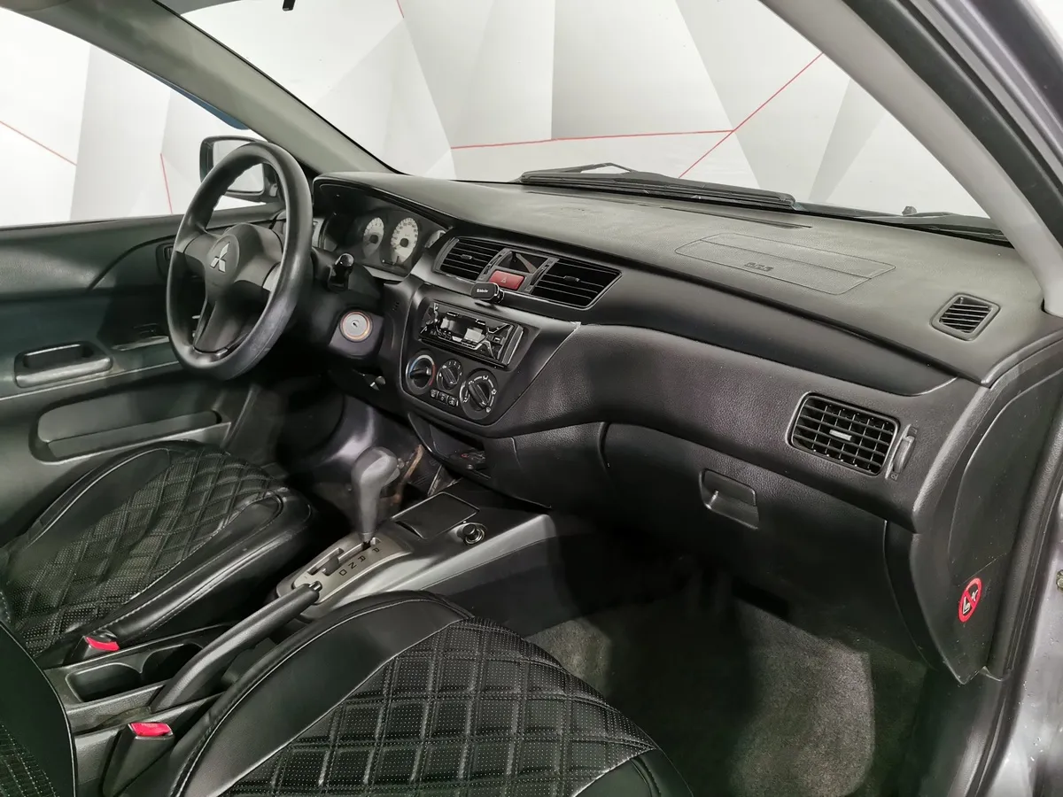 Mitsubishi Lancer 1.6 AT (98 л.с.) Серый в АВИЛОН. Слайд №10