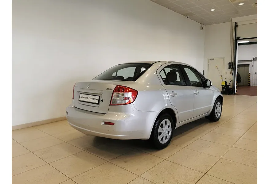 Suzuki SX4 1.6 MT (107 л.с.) Серебристый в АВИЛОН. Слайд №2