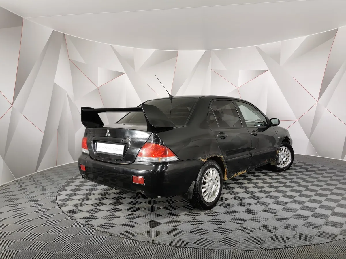 Mitsubishi Lancer 1.3 MT (82 л.с.) Черный в АВИЛОН. Слайд №2
