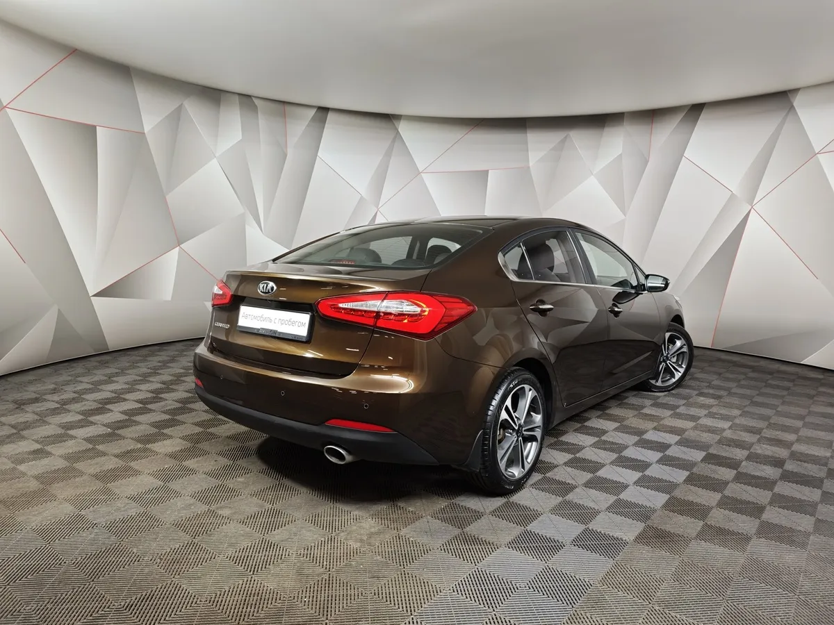 Kia Cerato 1.6 AT (130 л.с.) Коричневый в АВИЛОН. Слайд №2