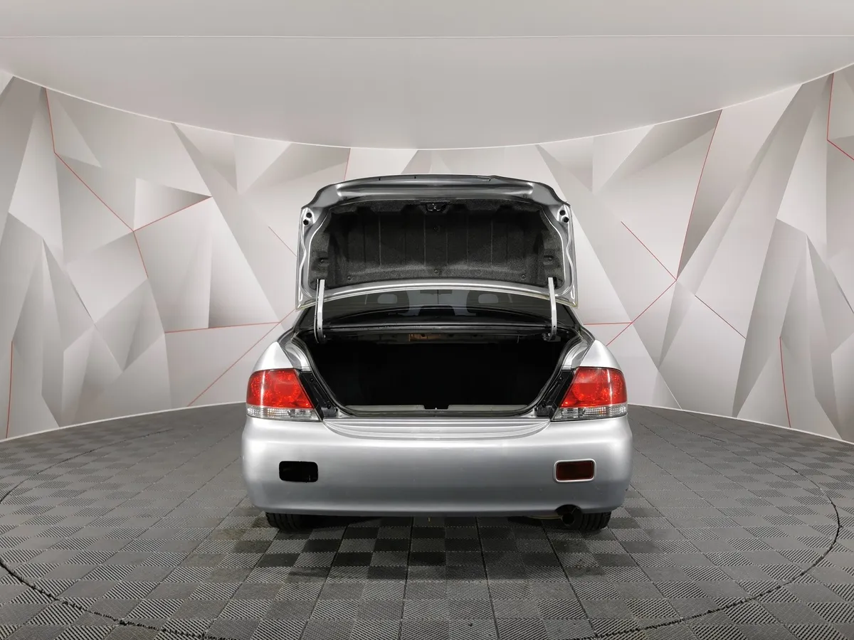 Mitsubishi Lancer 1.6 MT (98 л.с.) Серый в АВИЛОН. Слайд №11