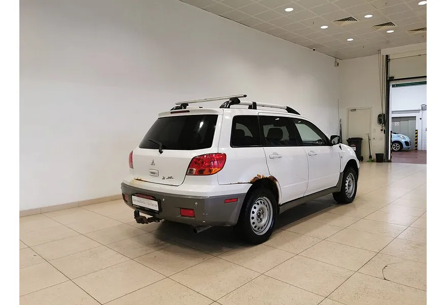 Mitsubishi Outlander 2.4 AT 4WD (160 л.с.) Белый в АВИЛОН. Слайд №2