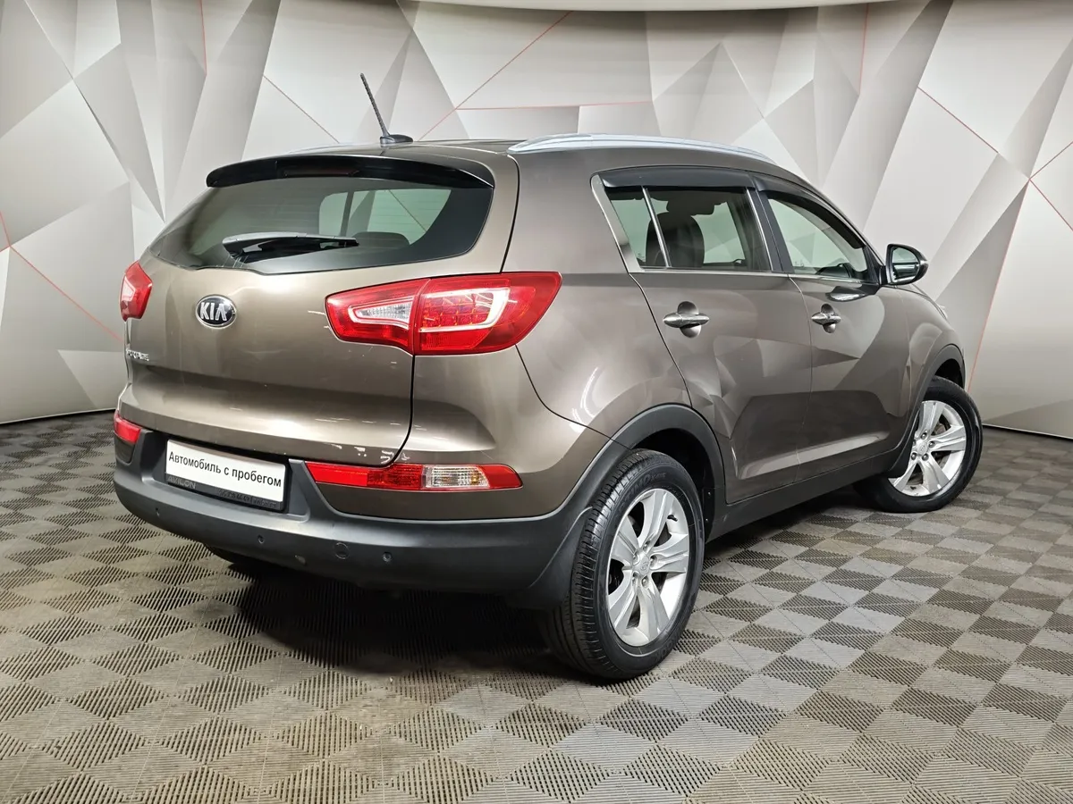 Kia Sportage 2.0 AT AWD (150 л.с.) Коричневый в АВИЛОН. Слайд №2