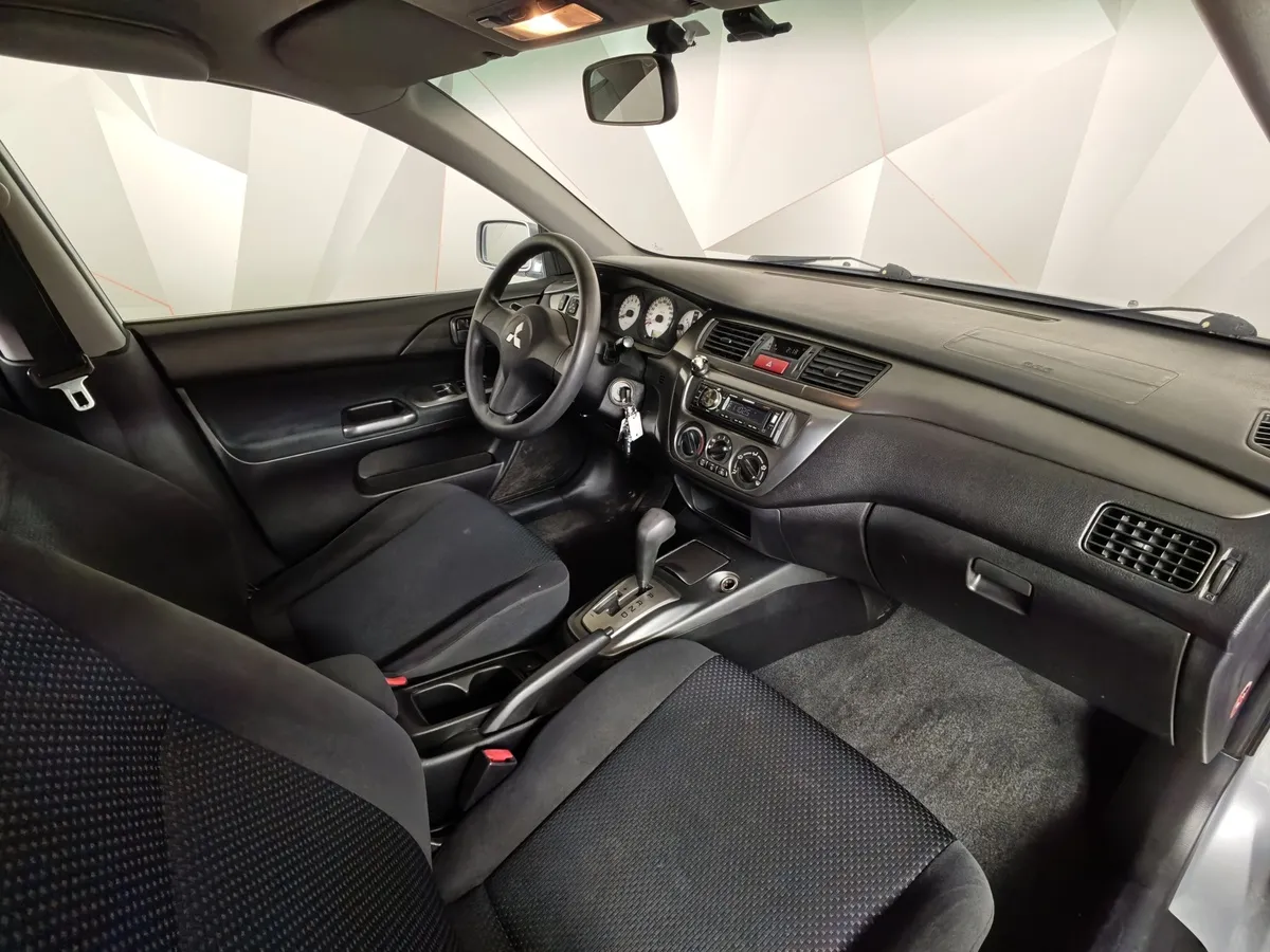 Mitsubishi Lancer 1.6 AT (98 л.с.) Серебристый в АВИЛОН. Слайд №11