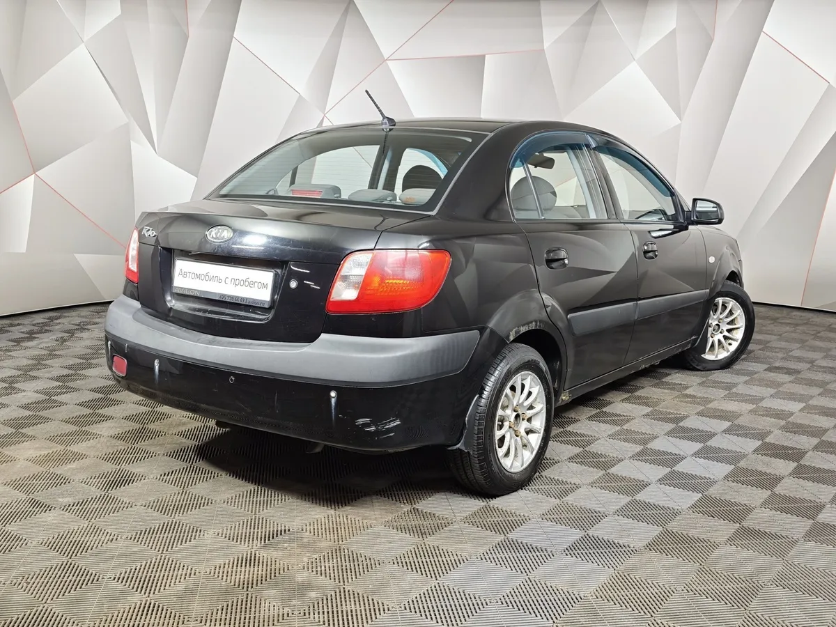 Kia Rio 1.4 AT (97 л.с.) Черный в АВИЛОН. Слайд №2