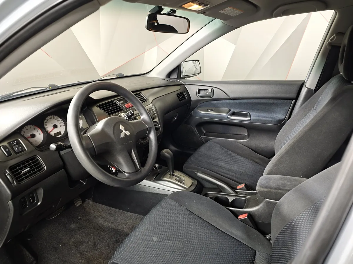 Mitsubishi Lancer 1.6 AT (98 л.с.) Серебристый в АВИЛОН. Слайд №17