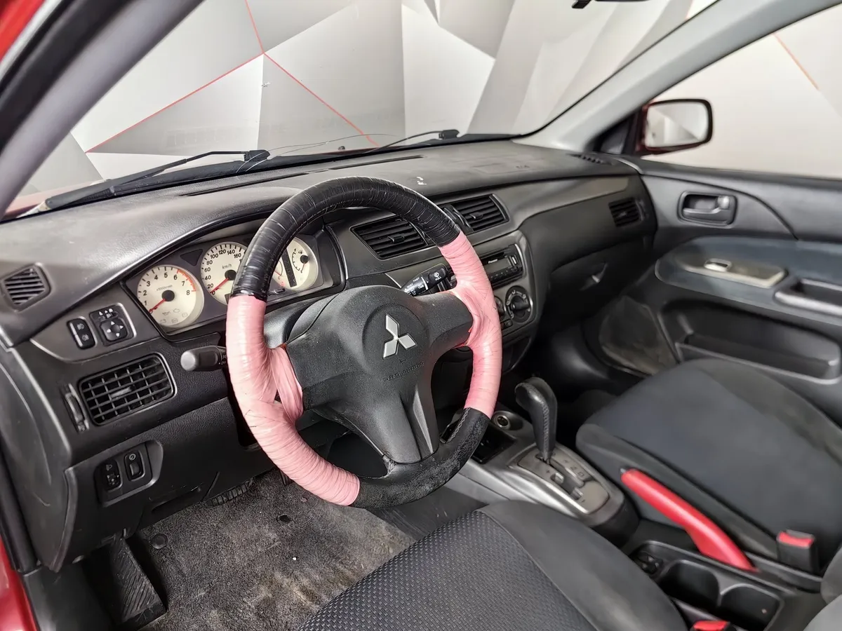 Mitsubishi Lancer 1.6 AT (98 л.с.) Красный в АВИЛОН. Слайд №14