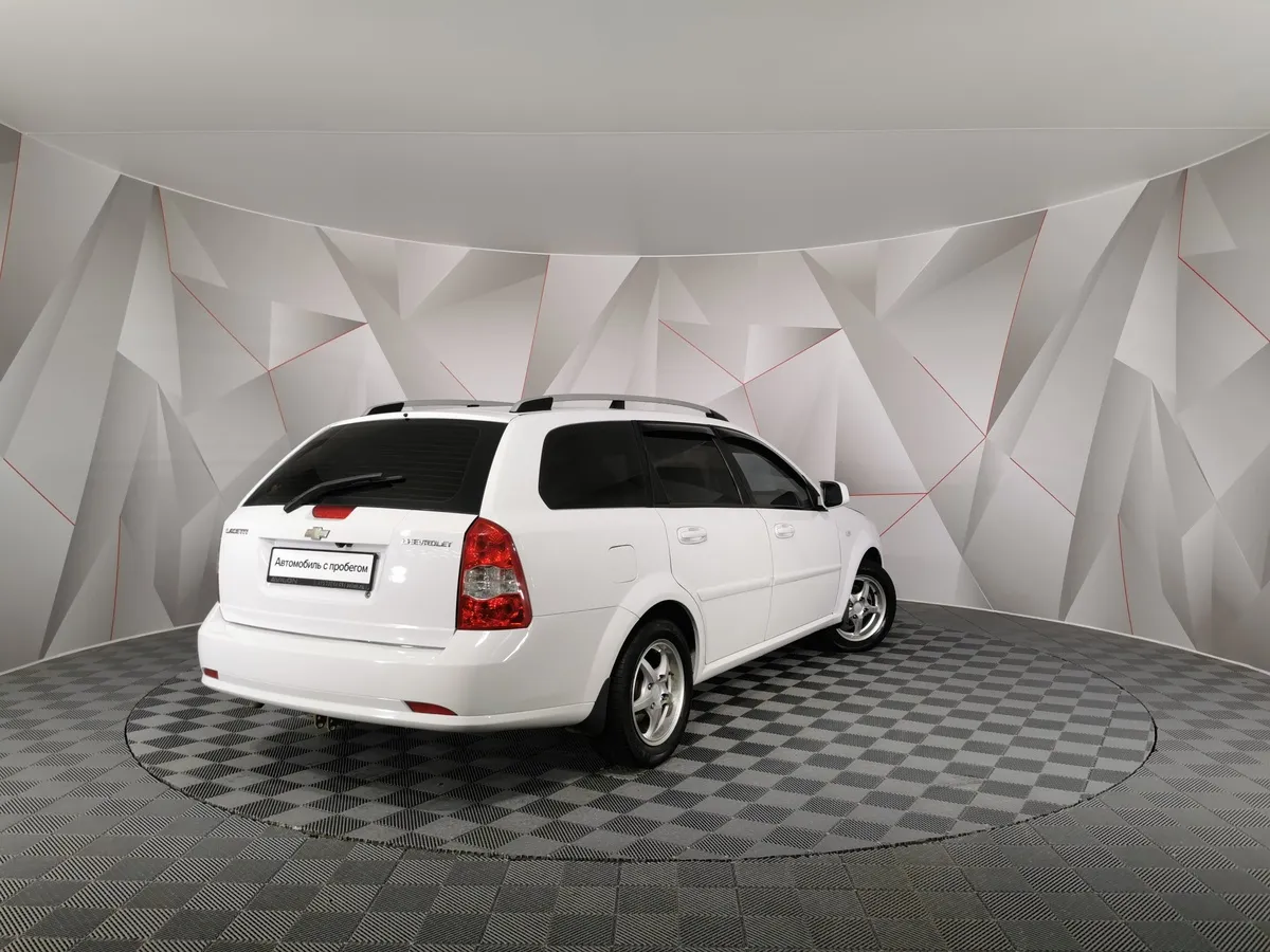 Chevrolet Lacetti 1.6 MT (109 л.с.) Белый в АВИЛОН. Слайд №2